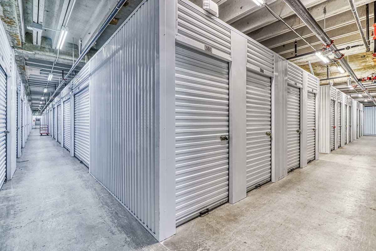 Clean, well-lit hallway of climate-controlled storage units at MyPlace Self Storage on Maple Ave in Dallas.