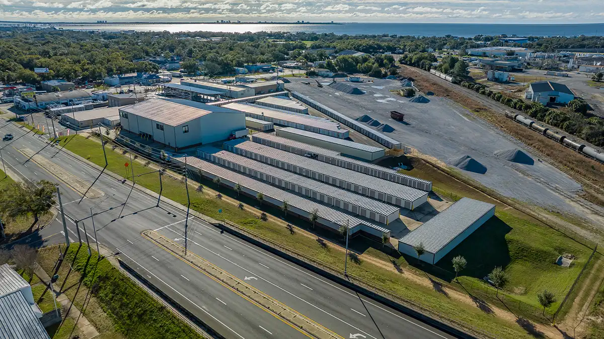 Aerial view of the MyPlace Self Storage facility on West Navy Blvd in Pensacola, FL, showing rows of drive-up units and proximity to the water.